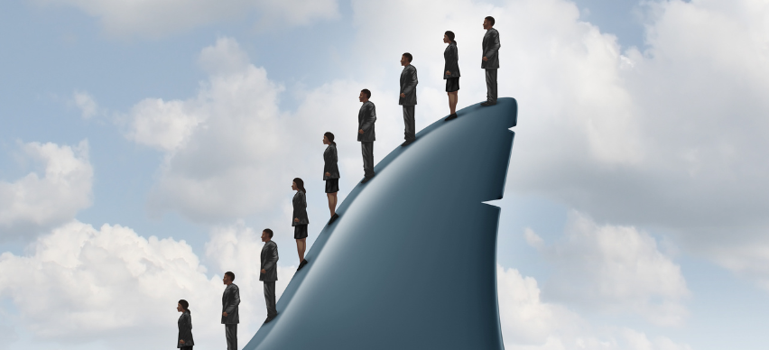 business people standing in line on a shark fin